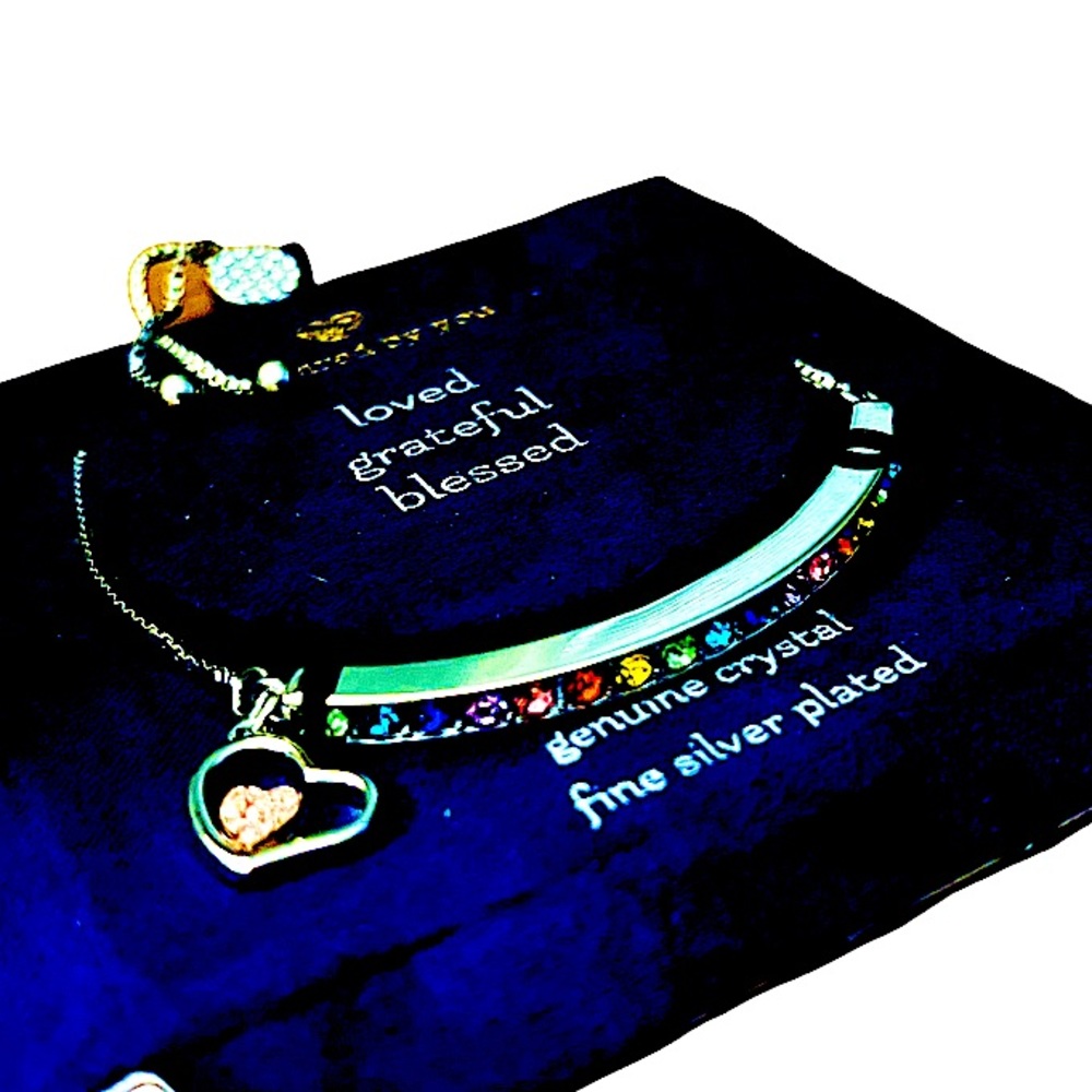 NWT: .925 silver plated, genuine rainbow crystal bracelet with bolo-style fasten